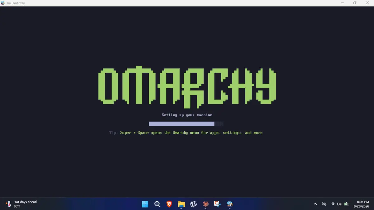 The Omarchy desktop inside the Try Omarchy window: a purple sunset wallpaper with Update System and Learn Keybindings notices in the top right.